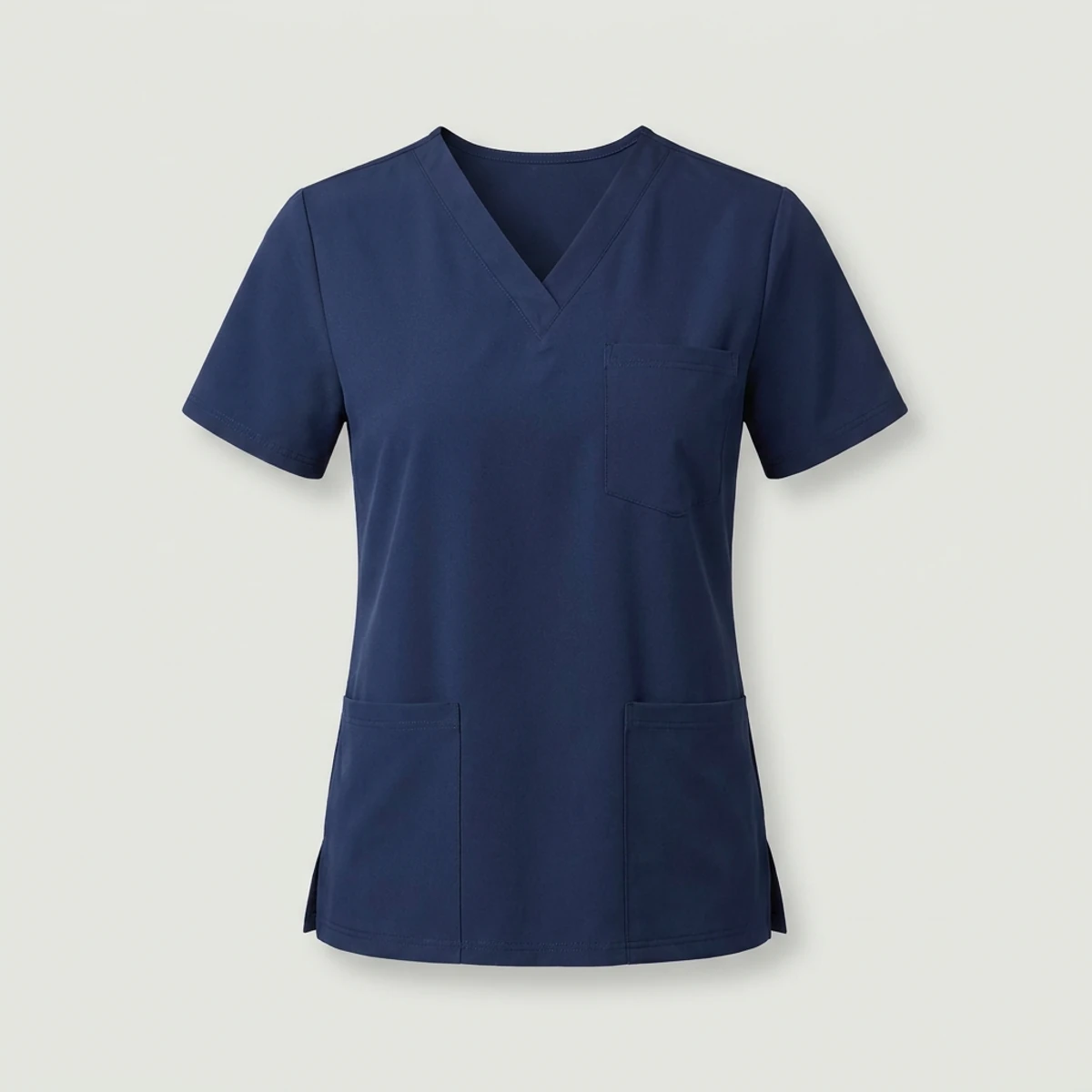 Navy V-neck scrub top in smooth poly-spandex twill with chest and lower pockets
