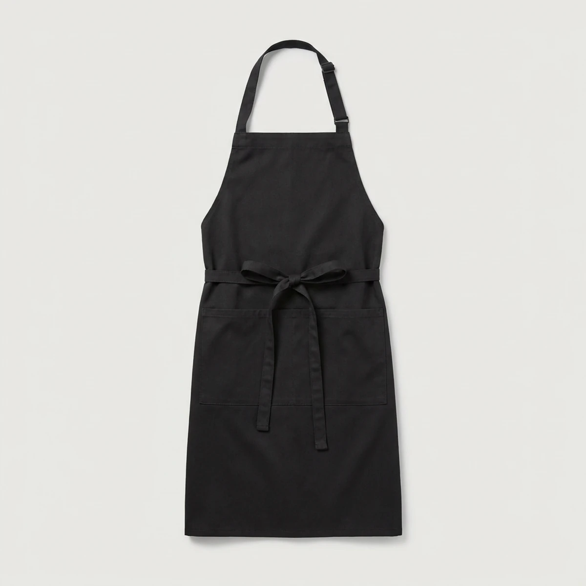 Black bib apron with adjustable neck strap, long ties and split pocket