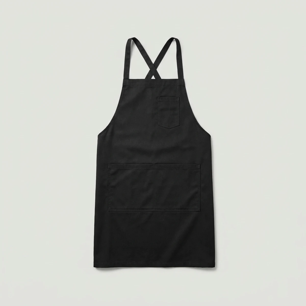 Black cross-back apron with split lower pocket and slim straps