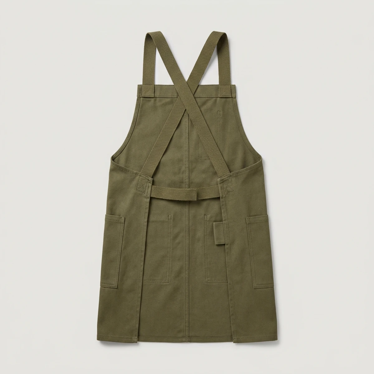 Olive canvas cross-back apron with webbing straps and towel loop