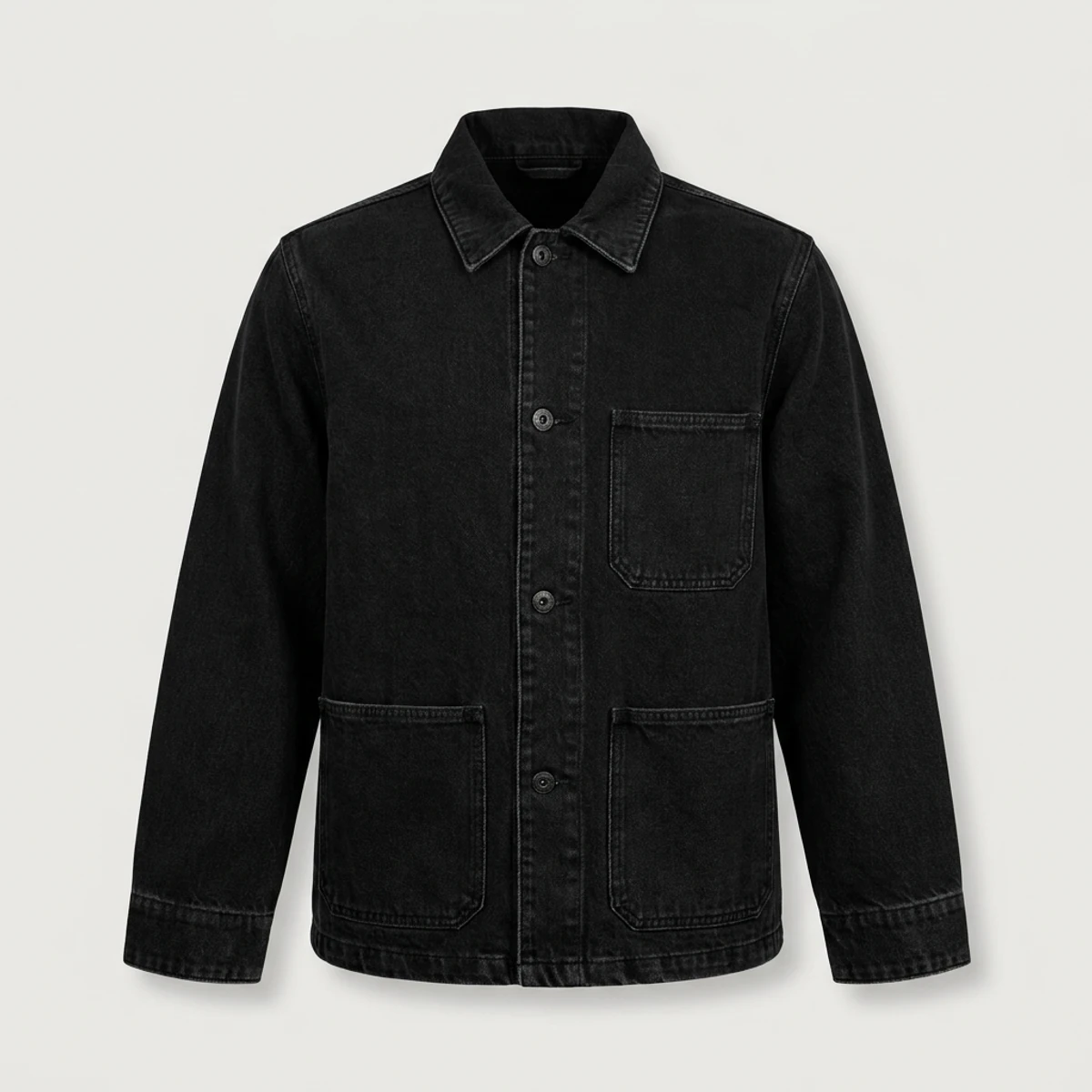 Black denim chore coat with three patch pockets and boxy fit