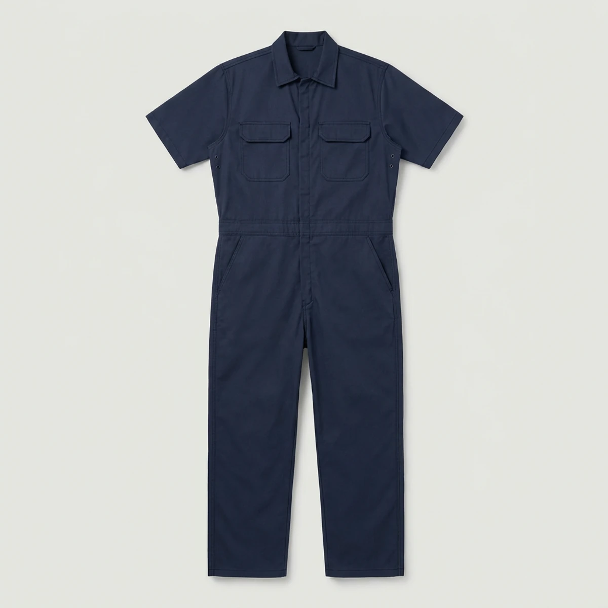 Navy short-sleeve work coverall with underarm eyelets and pockets