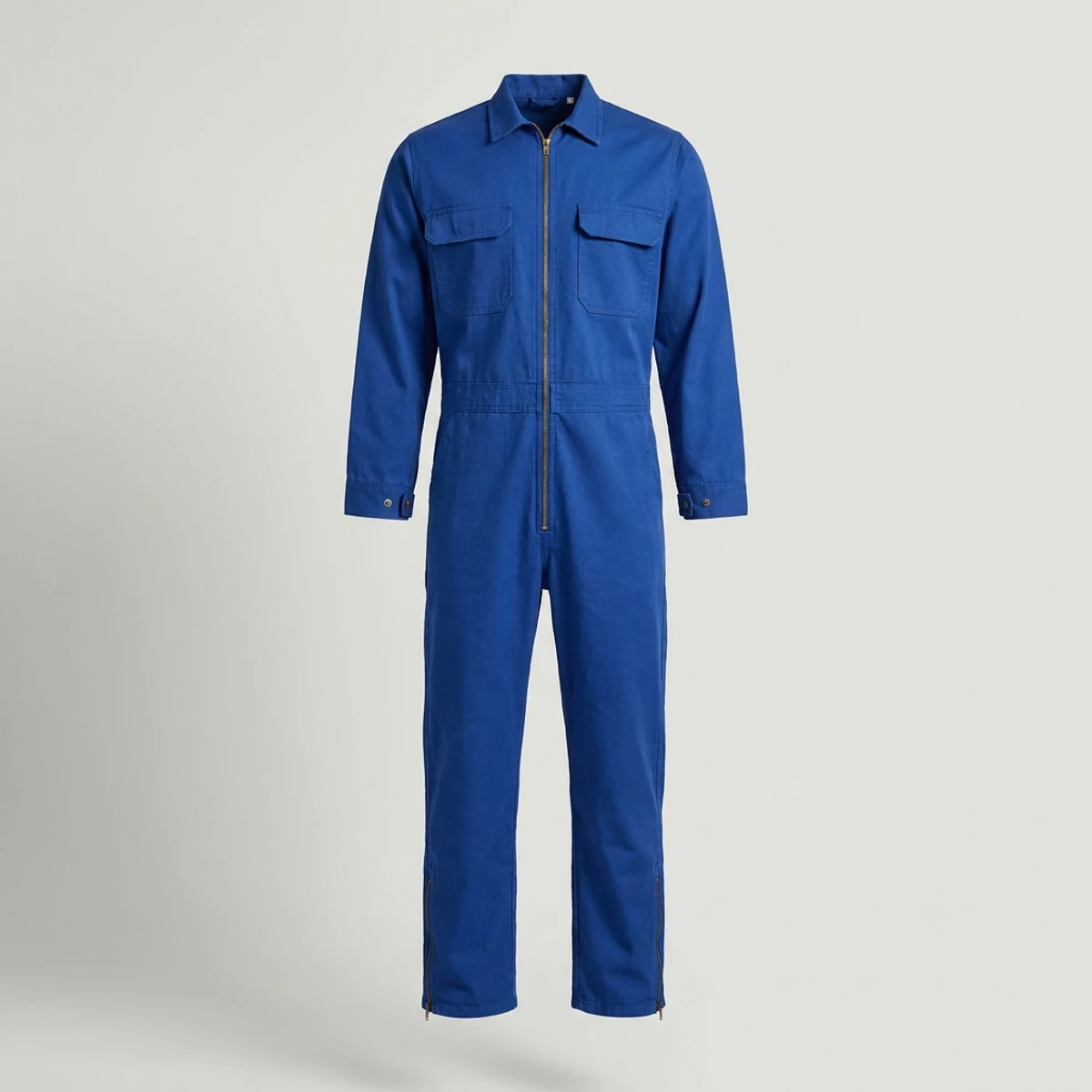 Royal blue flame-resistant coverall with snap cuffs and leg zippers