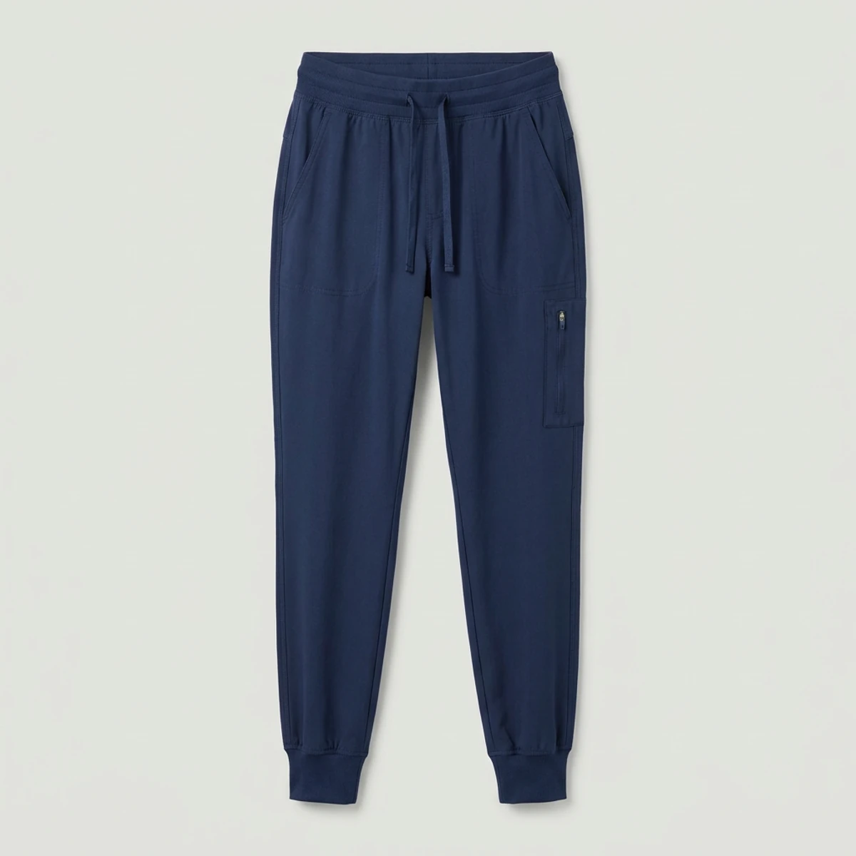 Navy jogger scrub pants with tapered leg and zip thigh pocket