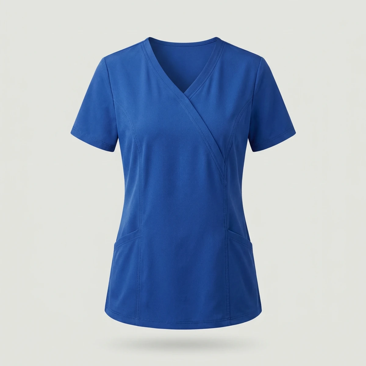 Royal blue mock wrap scrub top with crossed front panels and princess seams