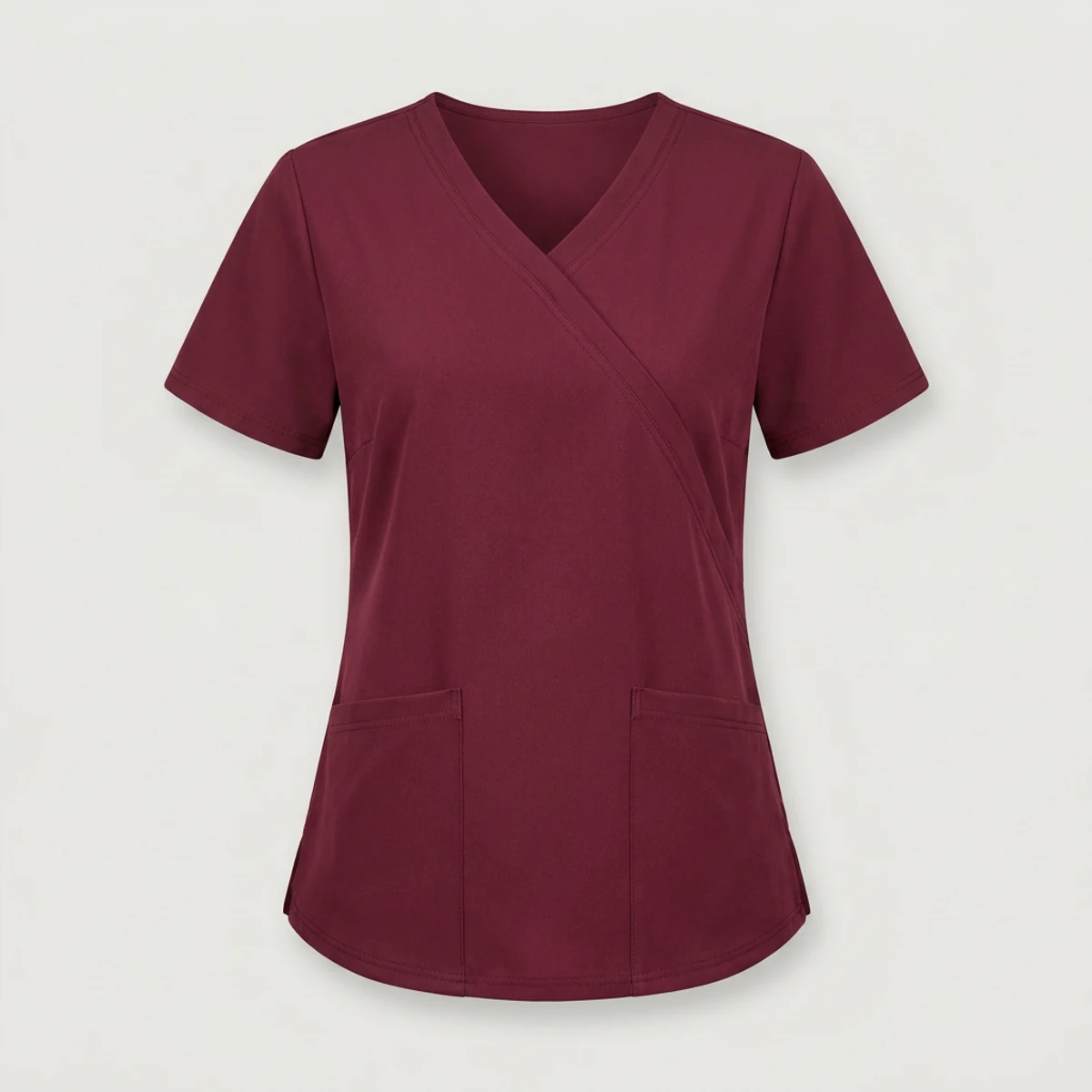 Wine red mock wrap scrub top with contrast-stitched patch pockets and short sleeves