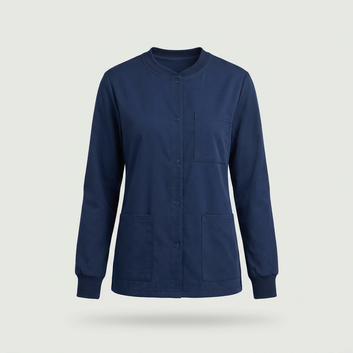 Navy snap-front warm-up scrub jacket with crew neck and three pockets