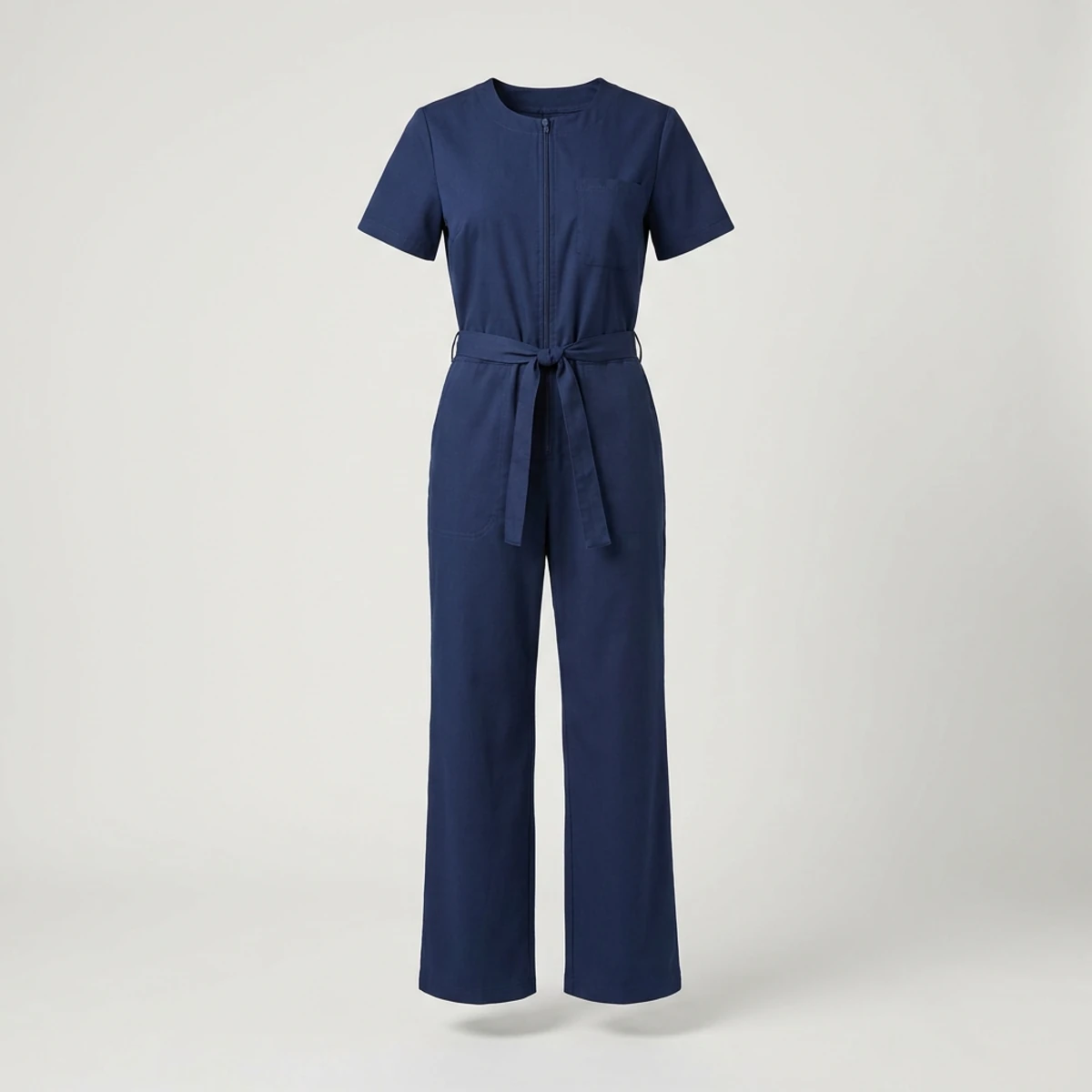 Navy wide-leg scrub jumpsuit with tie belt and chest pocket
