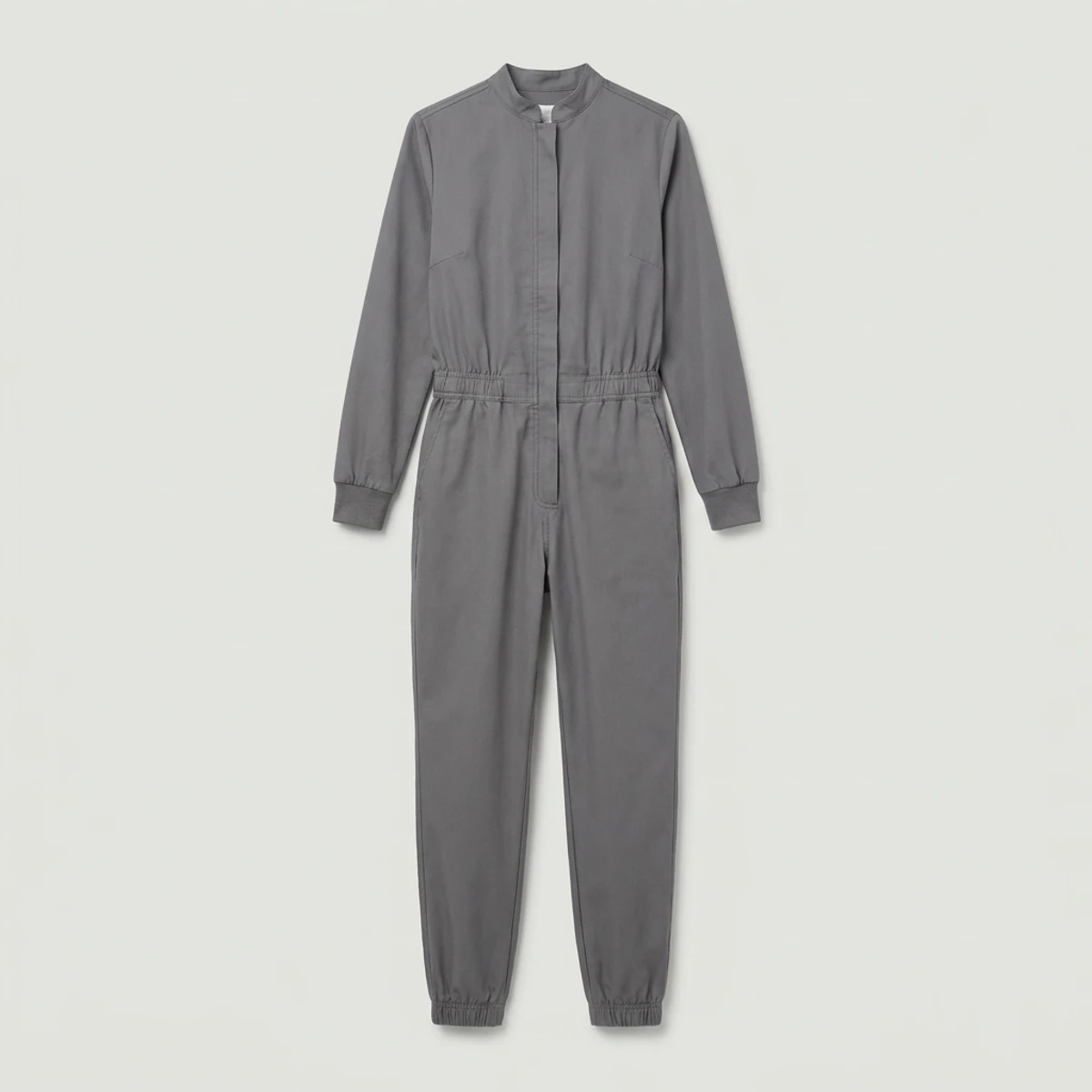 Pewter grey long-sleeve scrub jumpsuit with knit cuffs and zip front